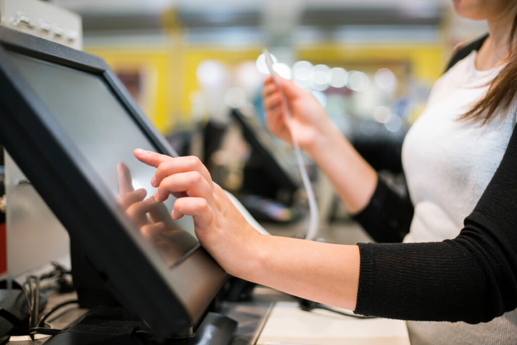 Dispensary worker at register